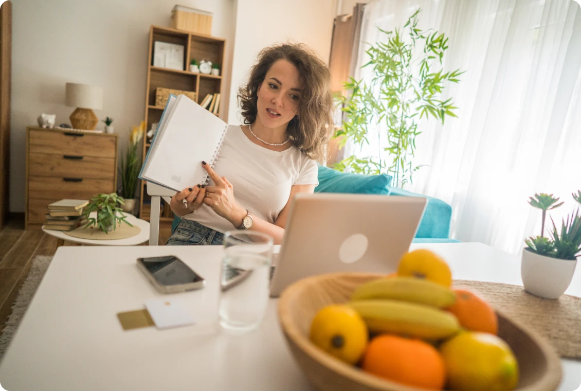 Home office setup with fruits and laptop