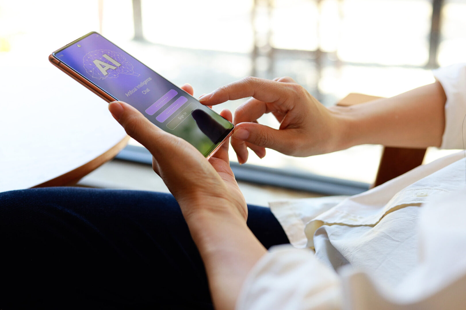 Woman using mobile phone to log in and chat with Artificial Intelligence chatbot. Robot application and global connection, AI, Artificial intelligence, innovation, and technology